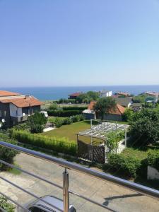 a view of the ocean from the balcony of a house at Къща Мариела in Sinemorets +24 photos