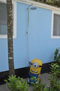 a fire hydrant in front of a blue building at Topcamp in Union Lido in Cavallino-Treporti