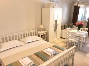 Postel nebo postele na pokoji v ubytování Apartments Rita