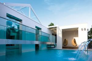 a house with a swimming pool with a slide at Topcamp in Union Lido in Cavallino-Treporti