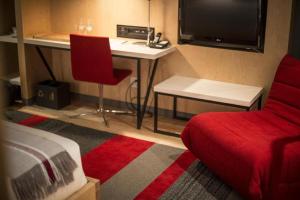 TV a/nebo společenská místnost v ubytování Hôtel & Spa Le Germain Charlevoix