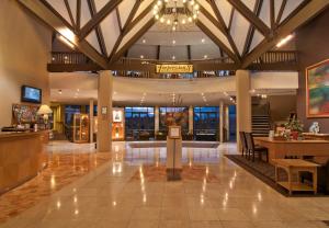 a lobby of a hotel with a chandelier at Copthorne Hotel & Resort Lakefront Queenstown in Queenstown