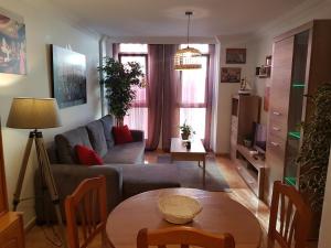 a living room with a couch and a table at Apartamento Hill Valley in Los Llanos de Aridane