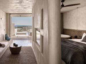 A bed or beds in a room at Olea All Suite Hotel, a Member of Design Hotels
