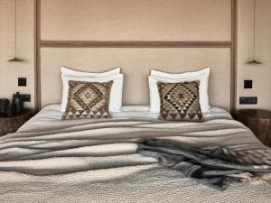 A bed or beds in a room at Olea All Suite Hotel, a Member of Design Hotels