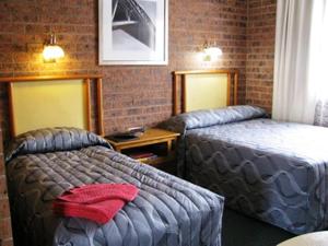 Postel nebo postele na pokoji v ubytování The Wayfarer Motel + 14 fotografií
