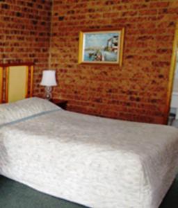 Postel nebo postele na pokoji v ubytování The Wayfarer Motel