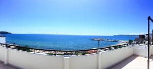 a view of the ocean from a balcony at Piatsa Michalis in Potos