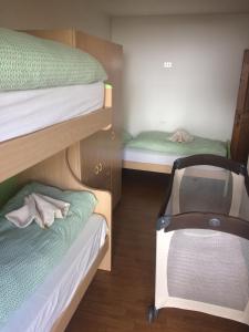 Postel nebo postele na pokoji v ubytování Appartamenti Gosetti
