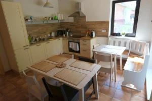 A kitchen or kitchenette at Wellness privát Štyri Lipy