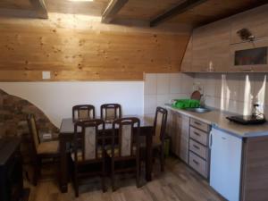 a kitchen with a table and chairs in a room at House SUN Z&B in Žabljak +63 photos