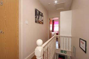 a staircase in a home with a stair case at The Railway Sleeper Lodge in Colchester