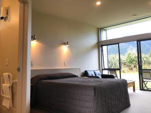 Postel nebo postele na pokoji v ubytování Sunset Motel