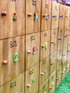 a wooden wall with buttons and numbers on it at Kea Garden Mini Chalet in Cameron Highlands