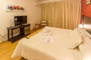 Un pat sau paturi într-o cameră la Hotel Las Maras