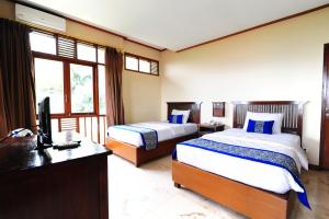Letto o letti in una camera di Dago Highland Resort