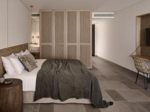 A bed or beds in a room at Olea All Suite Hotel, a Member of Design Hotels