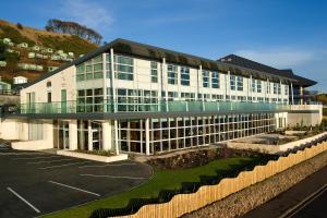 a large white building with a lot of windows at The Bay Hotel in Kinghorn