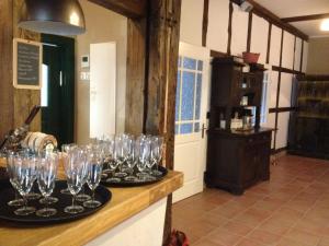 a group of wine glasses sitting on a counter at Hänigser Stuben in Hänigsen