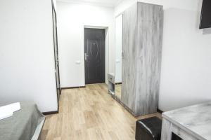 a room with a mirror and a room with a door at Hotel Beni in Akhaltsikhe
