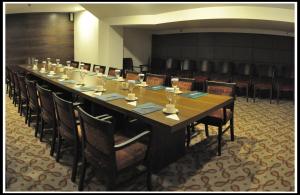 a long table in a room with chairs around it at Alba Hotel in Ankara