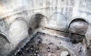 an inside view of a building with two arches at Hotel Beni in Akhaltsikhe