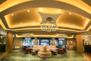 a lobby of a hotel with a chandelier at Marina Grand Beach Hotel - All Inclusive Plus in Golden Sands +39 photos