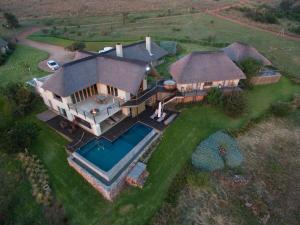 an overhead view of a house with a swimming pool at Sibani Lodge in Krugersdorp