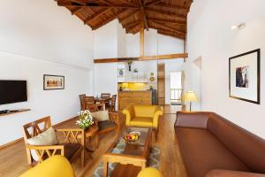 a living room with a couch and a table at The Pinewood, Nainital by Leisure Hotels in Nainital