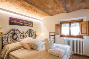 Ένα ή περισσότερα κρεβάτια σε δωμάτιο στο Florence Luxury House