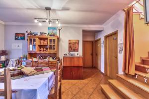 a living room with a table and a dining room at Casa Nana in Cadima