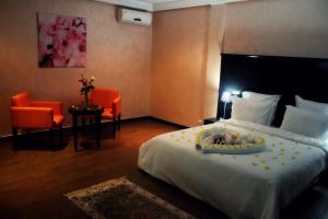 Ένα ή περισσότερα κρεβάτια σε δωμάτιο στο Ubay Hotel