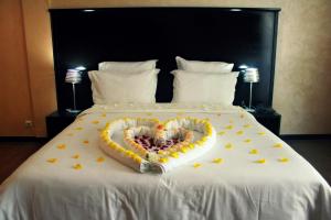 Ένα ή περισσότερα κρεβάτια σε δωμάτιο στο Ubay Hotel