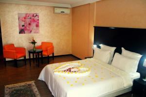 Ένα ή περισσότερα κρεβάτια σε δωμάτιο στο Ubay Hotel