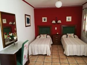 Postel nebo postele na pokoji v ubytování Hostal Maestre