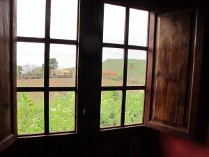 
a window with a view of a grassy field at Haciendas del Valle - Las Kentias in Valle de Guerra

