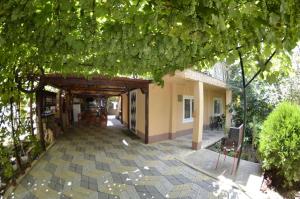 a hallway of a building with a patio at Casa Bibi in Costinesti