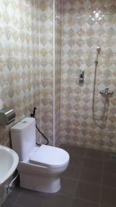 Kylpyhuone majoituspaikassa TULIP HOTEL & APARTMENT