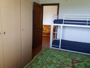 a bedroom with two bunk beds and a closet at Gioiamare in Martinsicuro