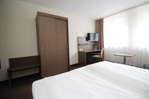 Postel nebo postele na pokoji v ubytování Hotel Berliner Ring