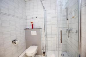 a bathroom with a shower and a toilet at Hotel Berliner Ring in Bamberg