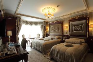 Postel nebo postele na pokoji v ubytování Ottoman's Life Hotel S Class