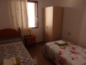 Postel nebo postele na pokoji v ubytování Las Cañas Luisa