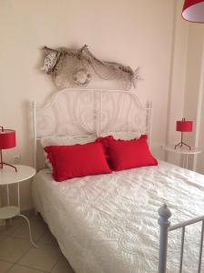 Un ou plusieurs lits dans un hébergement de l'établissement La casa allegra in rosso