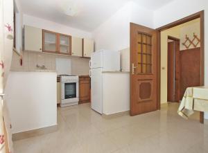 Kuchyň nebo kuchyňský kout v ubytování Apartments Luciano 1728