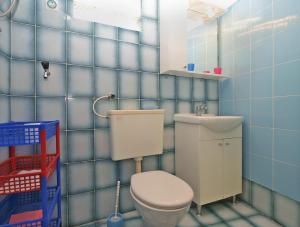Koupelna v ubytování Apartments Luciano 1728 + 22 fotografií