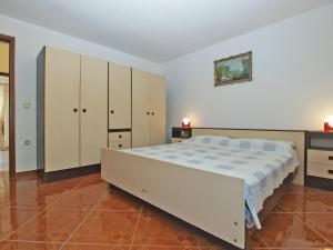 Postel nebo postele na pokoji v ubytování Apartments Luciano 1728