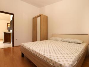 Postel nebo postele na pokoji v ubytování Apartments Luciano 1728
