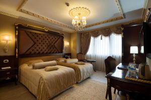 Postel nebo postele na pokoji v ubytování Ottoman's Life Hotel S Class