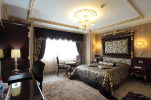 Postel nebo postele na pokoji v ubytování Ottoman's Life Hotel S Class